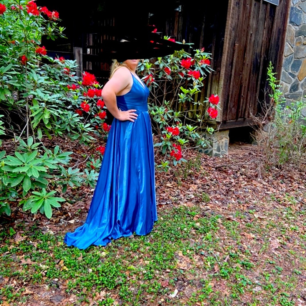 Prom dress by Alyce it is a deep French blue color